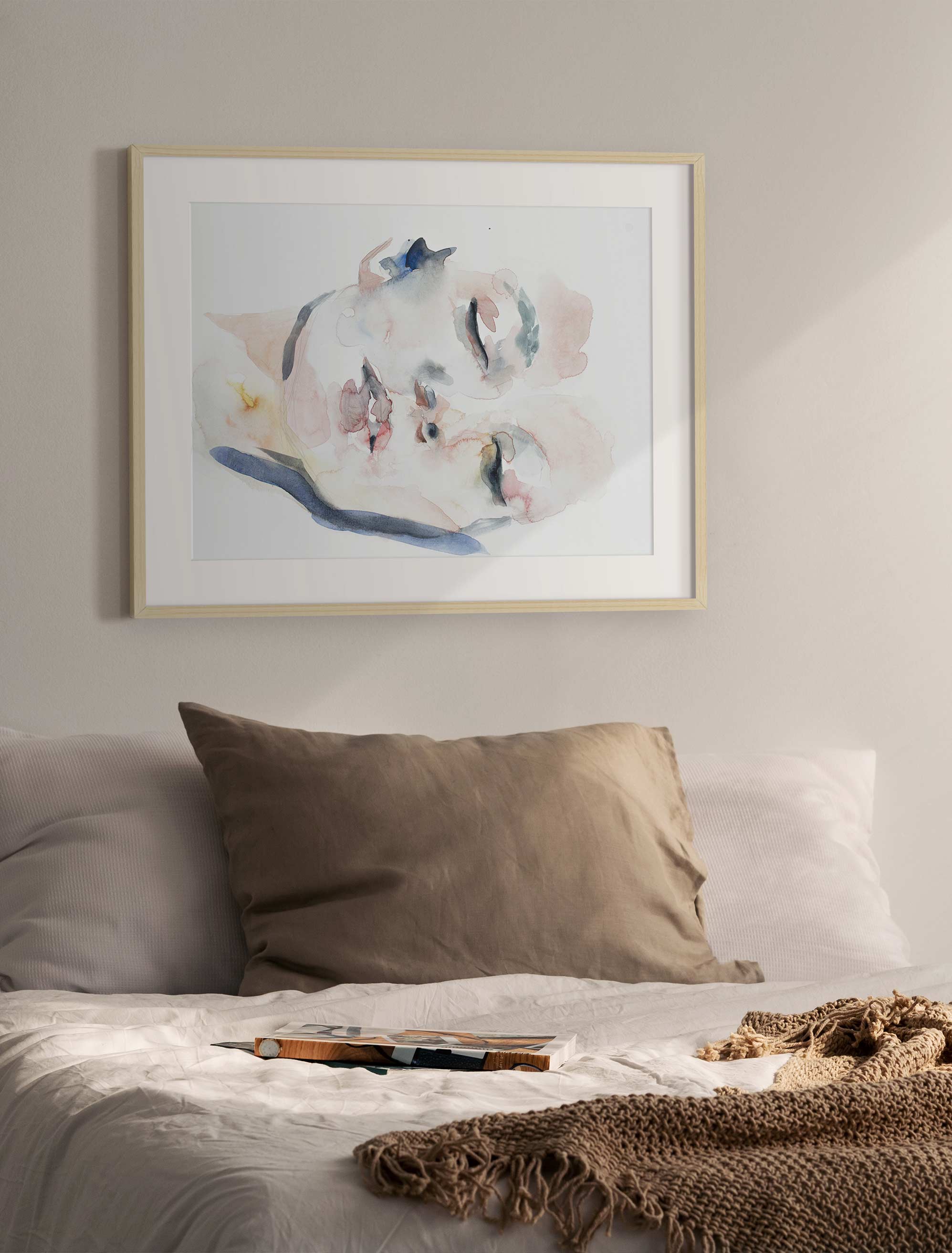 A single soft piece, well placed above the bed, is often all a room needs.