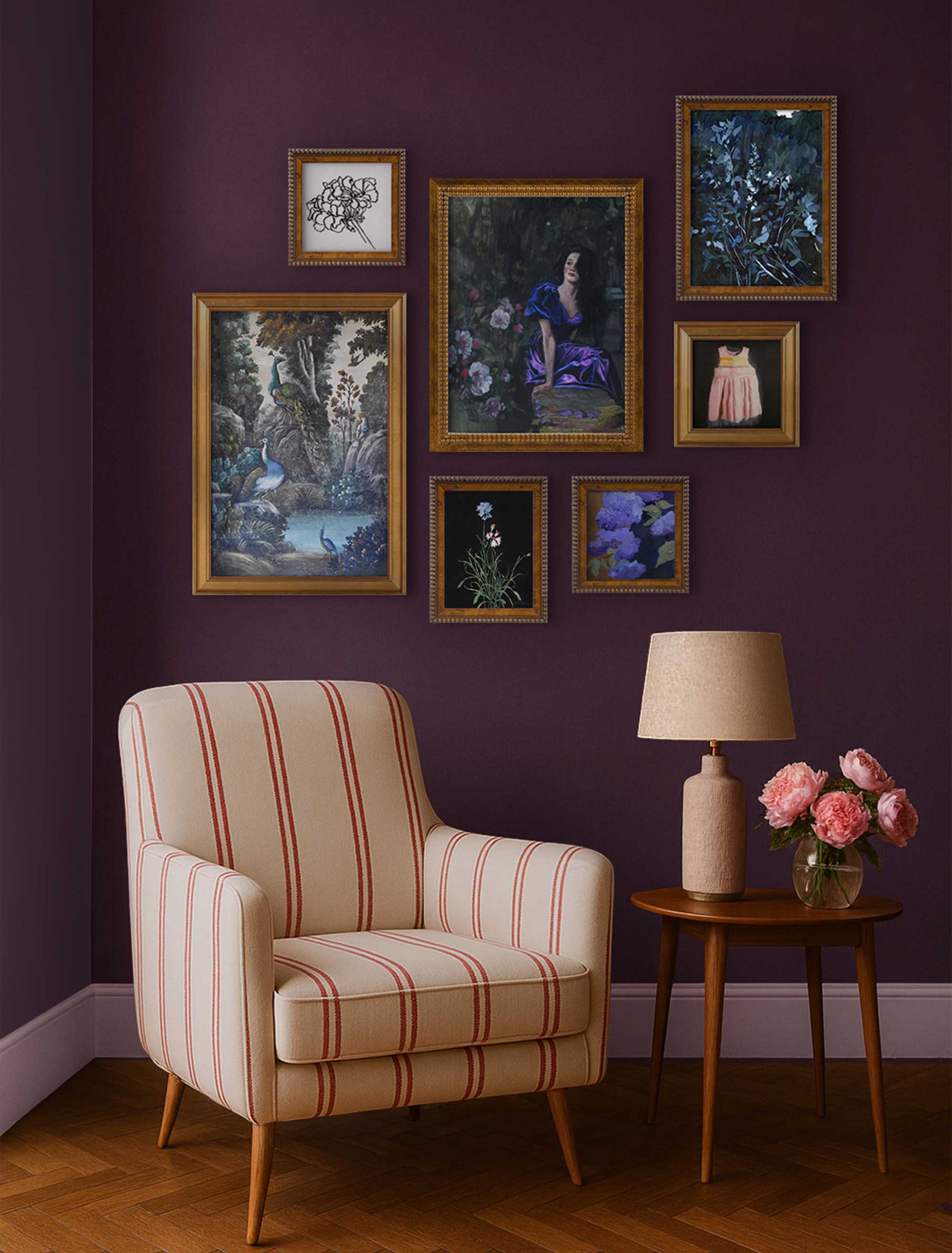 A moody gallery wall of deep florals, portraits, and abstracts shows how dramatic art can make a room feel rich rather than heavy.
