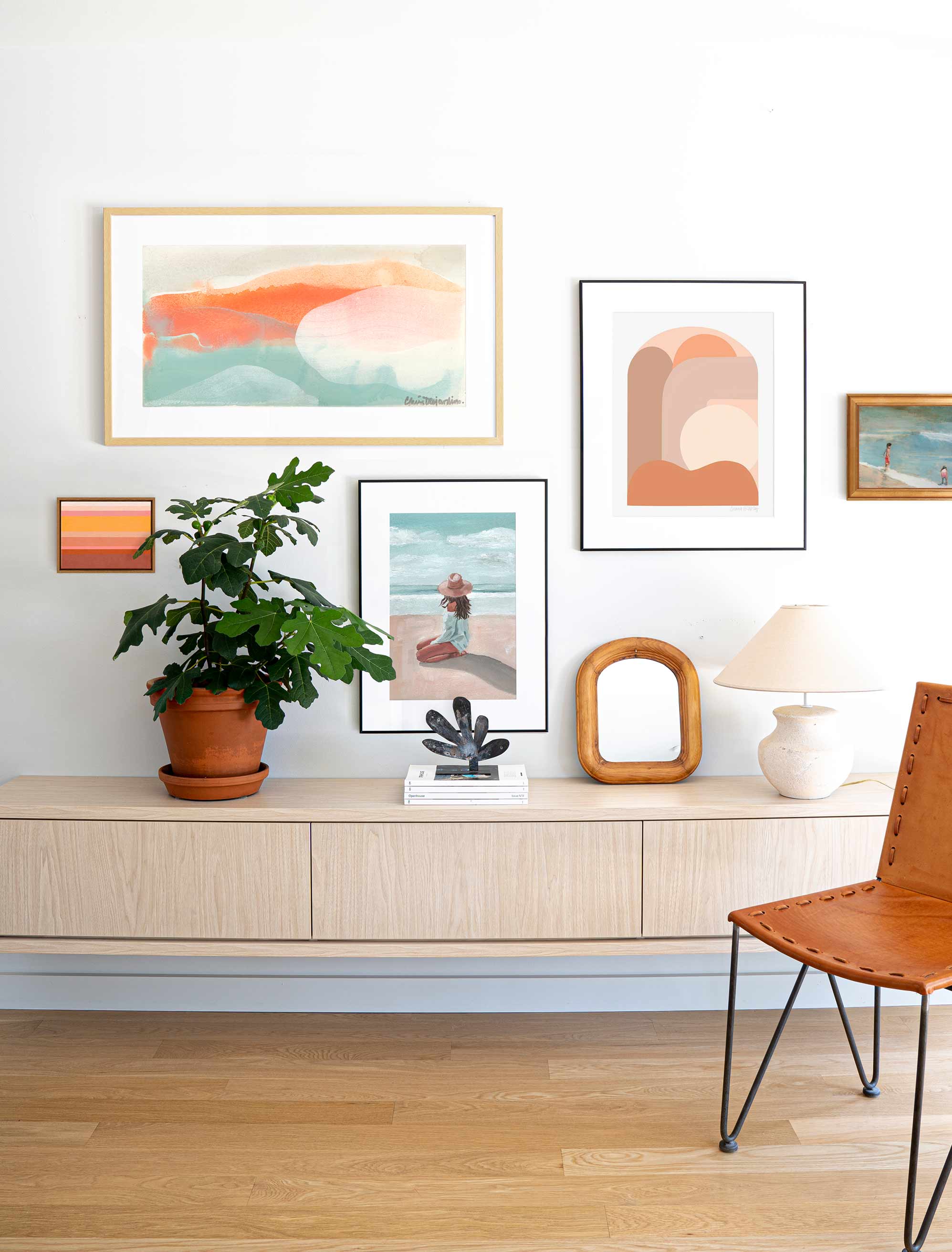 An example of a perfectly arranged gallery wall in a contemporary room.