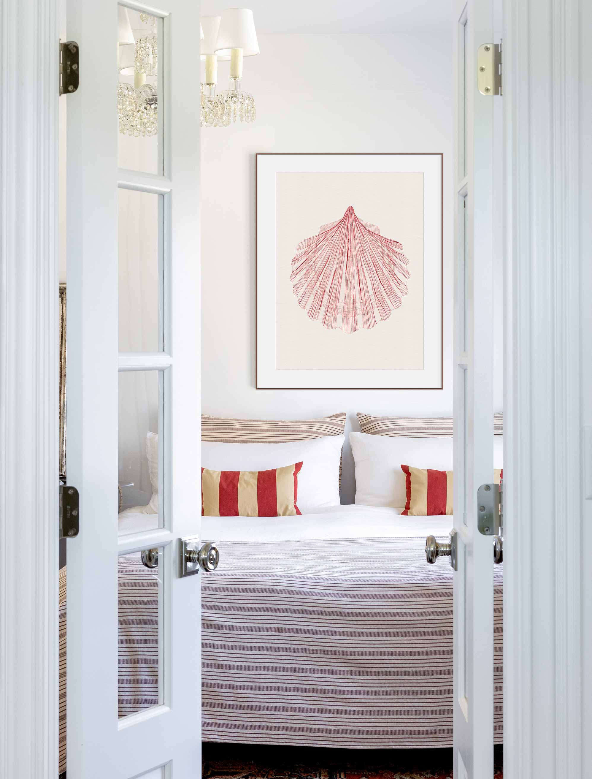 One large print above the headboard makes a calm, confident focal point in this bedroom.