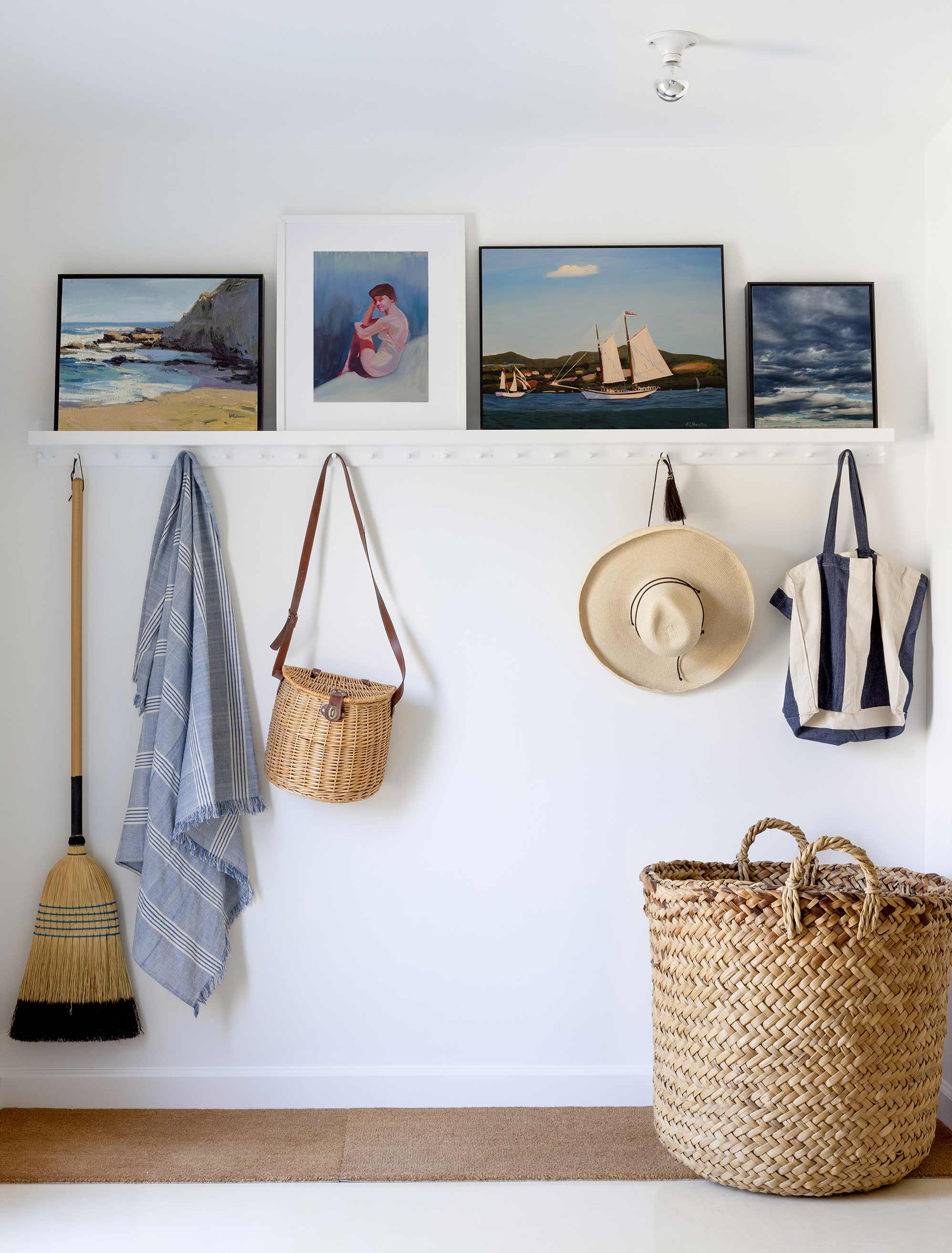 Leaning art on a shelf creates a focal art display that is afforadable and doesn't damage walls.