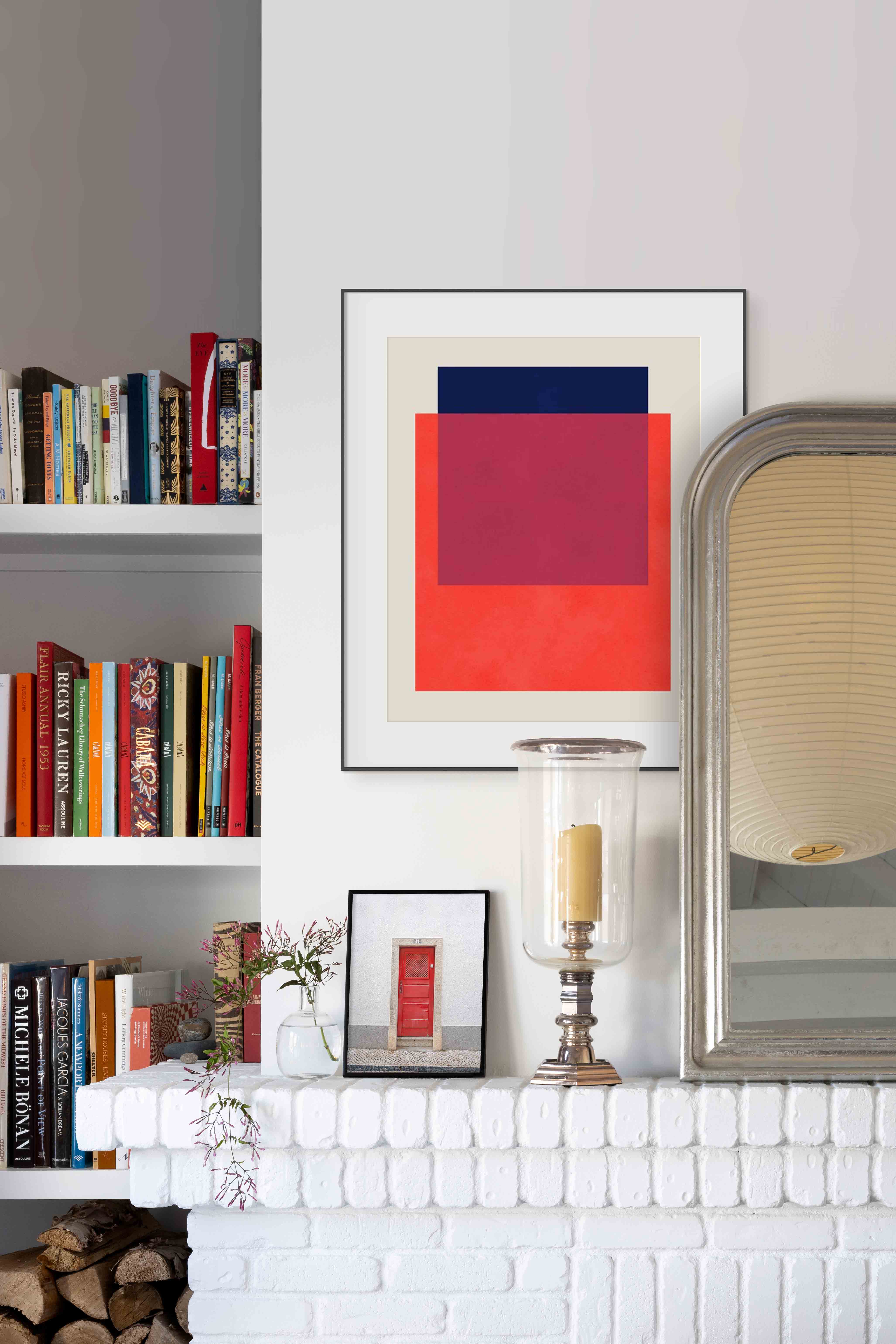 A graphic geometric abstract is placed in a traditonal living room for juxtaposition and a look that is modern and chic.